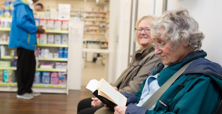 Elderly ladies in pharmacy.