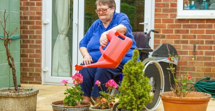 Older woman gardening.