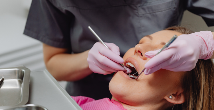 Woman being treated by a dentist