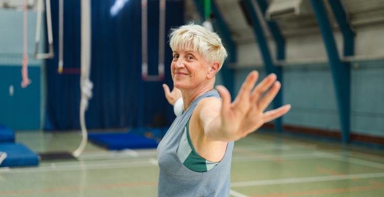 Woman exercising in a gym.