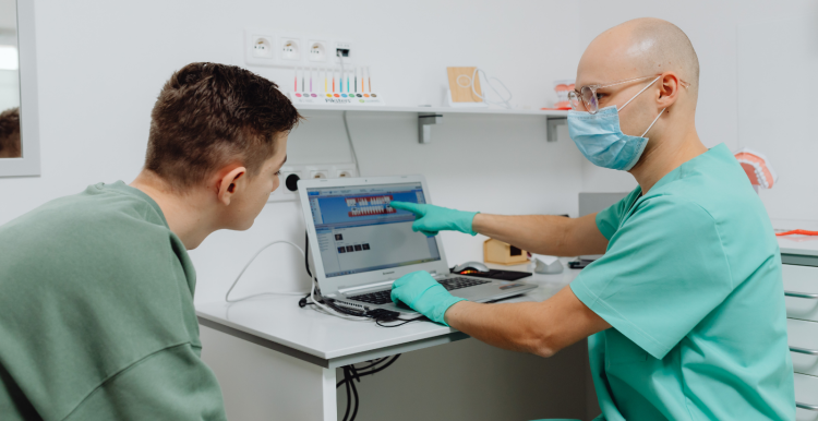Dentist and a patient in a dental office. 