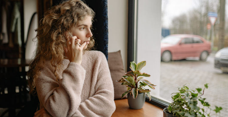 Woman talking on phone indoors