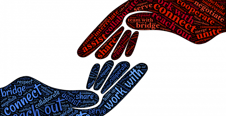Two hands with lots of words in blue and red