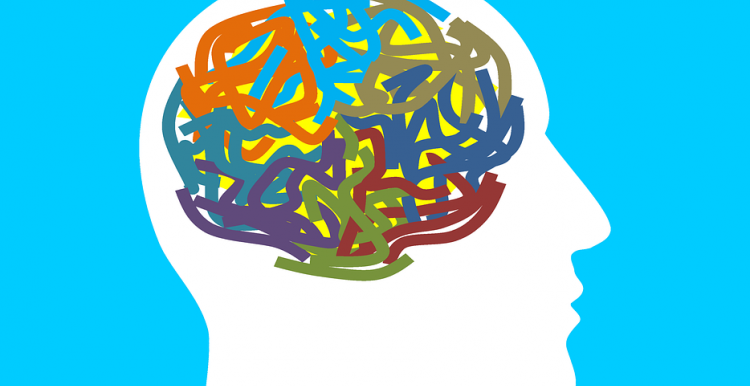 Drawing, Outline of Head, Multicoloured Wriggly Lines to represent mind, blue background