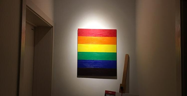 Dimly lit hallway, Canvas of Rainbow centrally framed