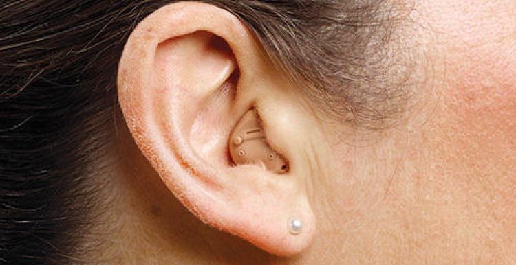 womens-ear-with-hearing-aid