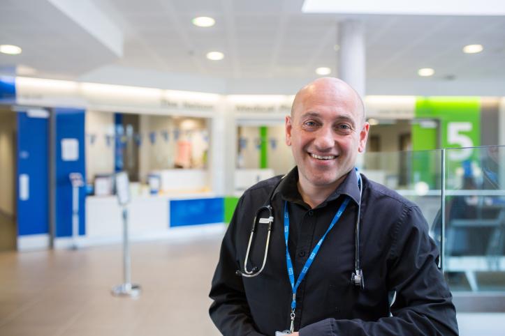 Medical professional smiling in a hospital setting 