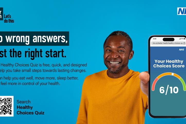 A man holding a phone on a blue backdrop advertising the new NHS Healthy Choices Quiz