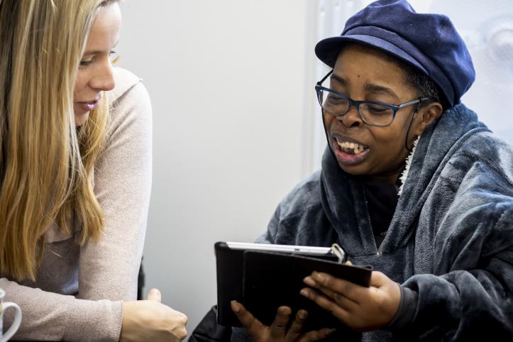 Two women looking at an iPad 