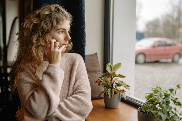 Woman talking on phone indoors