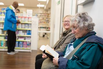 Elderly ladies in pharmacy.