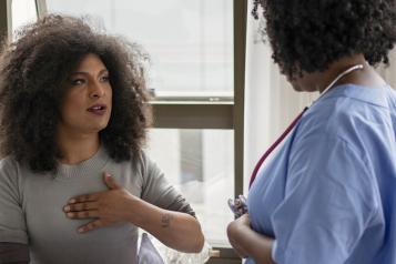 One woman speaking to a medical professional.