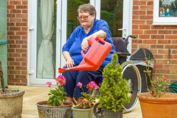 Older woman gardening.