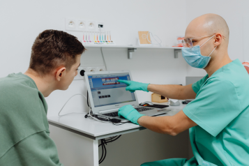 Dentist and a patient in a dental office. 