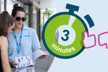 Two women stand outside talking. One's back is to the camera. The other faces the camera wearing sunglasses. The image features a clock graphic.