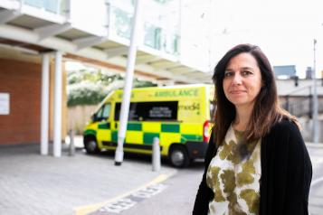 Lady next to ambulance