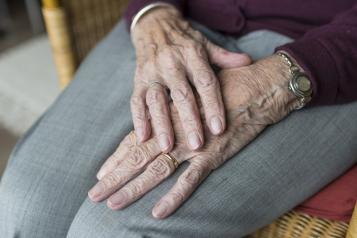 Close up image, elderly woman, Hands on lap