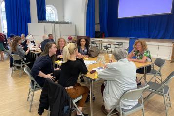 People sitting around a table talking