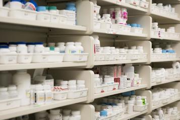 White Shelves, Full of different medications in various types of white bottles and containers