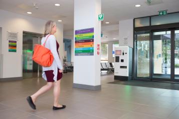 Lady walking out of a hospital