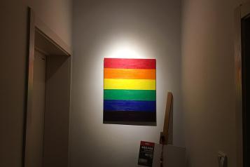 Dimly lit hallway, Canvas of Rainbow centrally framed
