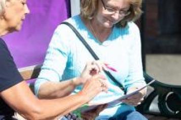 Two women looking at a document