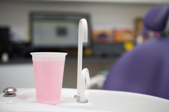 A close-up of a dentist's sink.