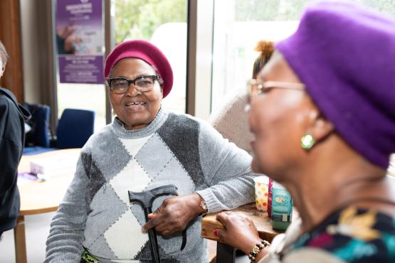 Two older women sat down and chatting