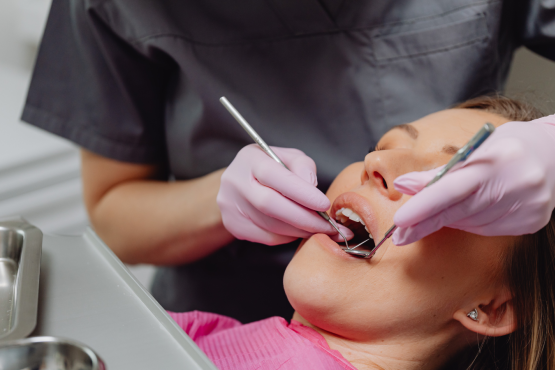 Woman being treated by a dentist
