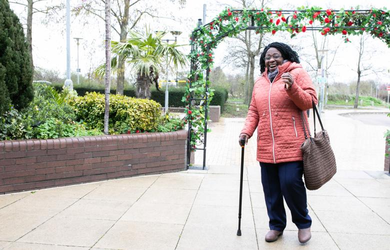 Older adult walking in cold weather.