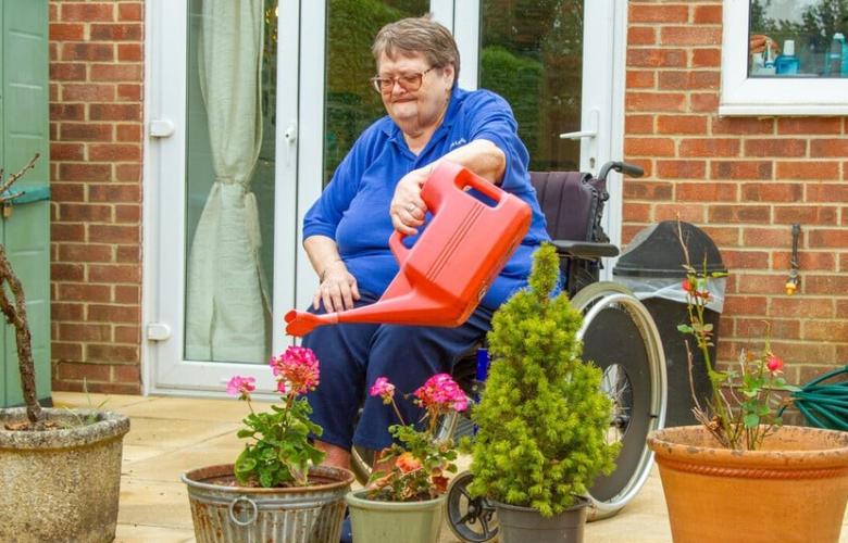 Older woman gardening.