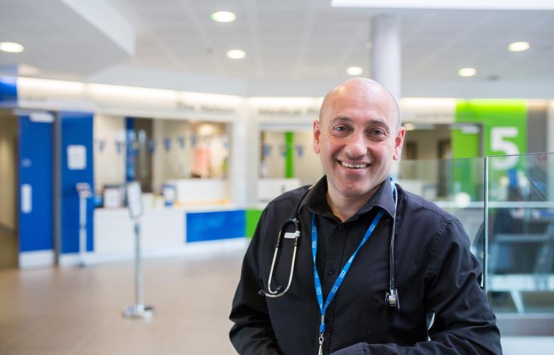 Medical professional smiling in a hospital setting 