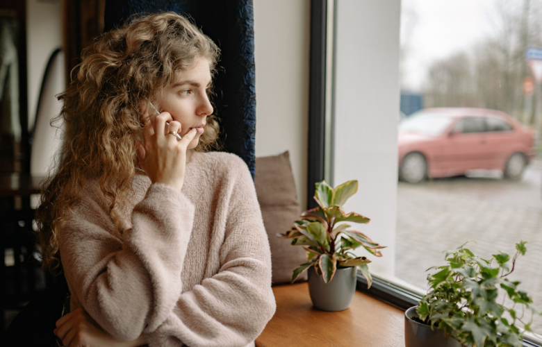 Woman talking on phone indoors