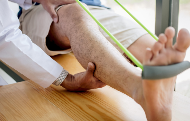 A medical professional examining a person's leg.