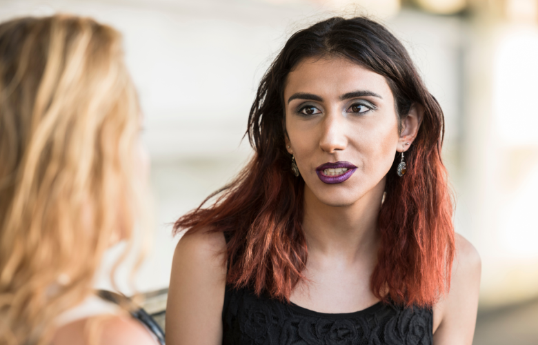 A woman talking to another person.
