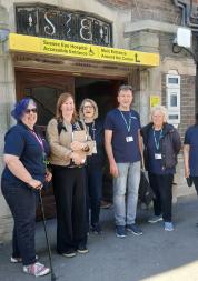A team of volunteers and staff members outside Sussex Eye Hospital. 