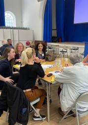 People sitting around a table talking