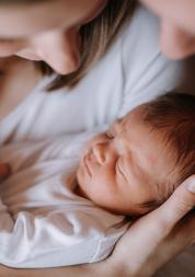 People holding newborn